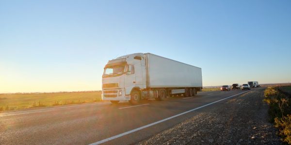 semi-truck-with-cargo-trailer-driving-on-highway-h-2024-12-06-20-06-46-utc-min